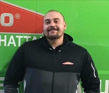 man in front of a SERVPRO van